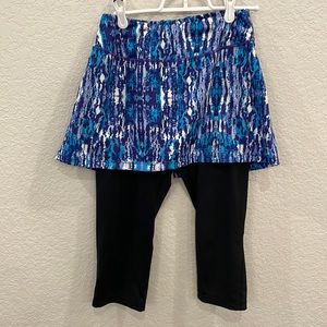 SkirtSports black, purple, turquoise and white skirted leggings, size Small